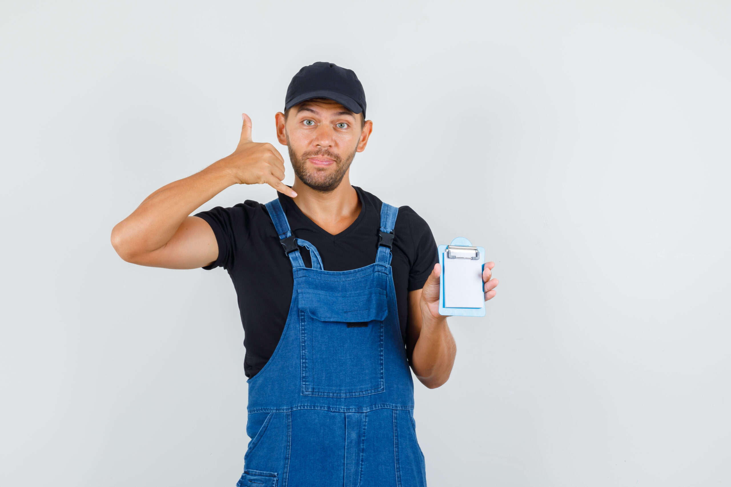 https://rnrplumbing.co.uk/wp-content/uploads/2023/08/young-loader-holding-mini-clipboard-with-phone-gesture-uniform-front-view-scaled.jpg